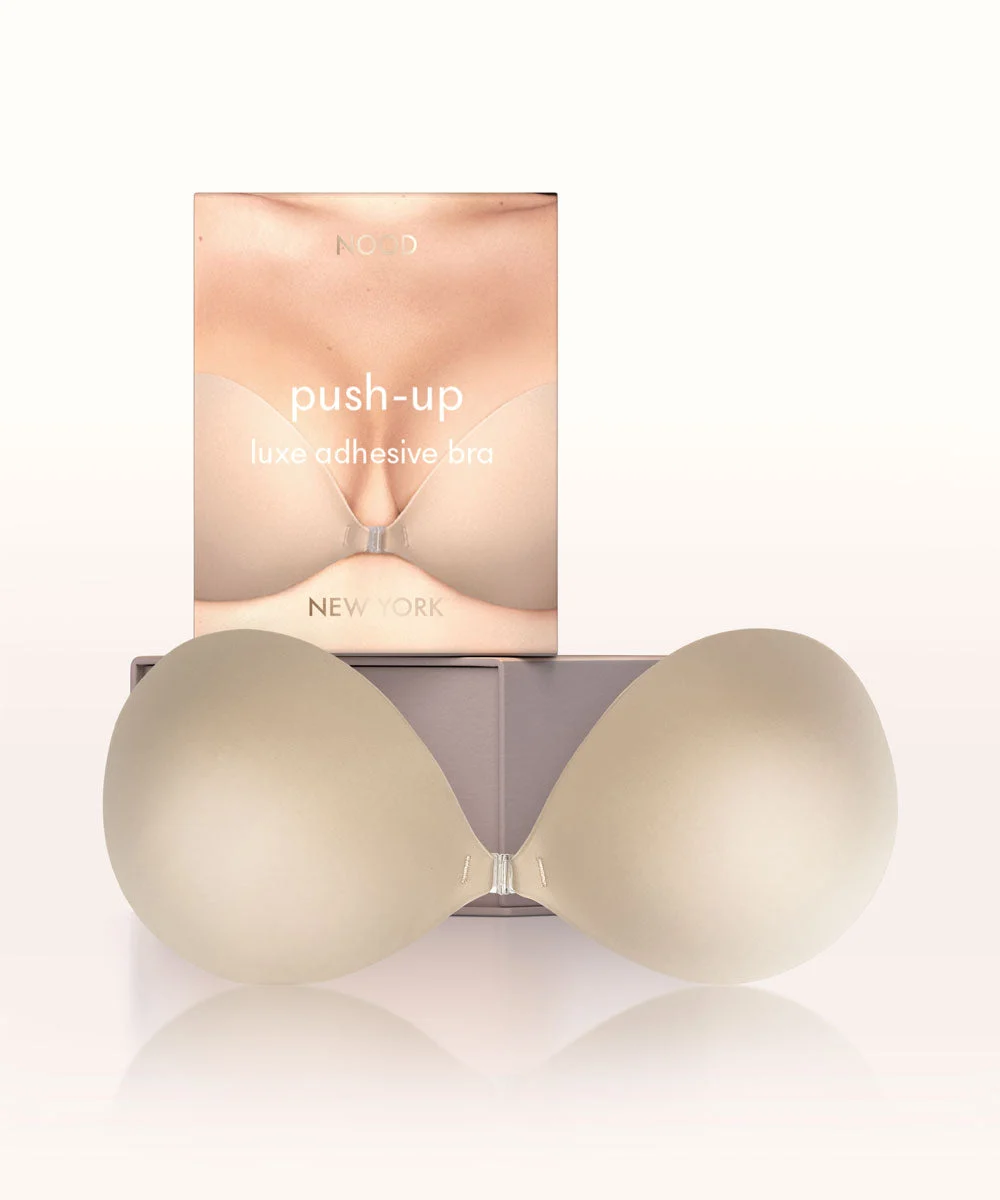 Official NOOD Push Up Adhesive Bra product photograph with clasped padded cups and its branded box.