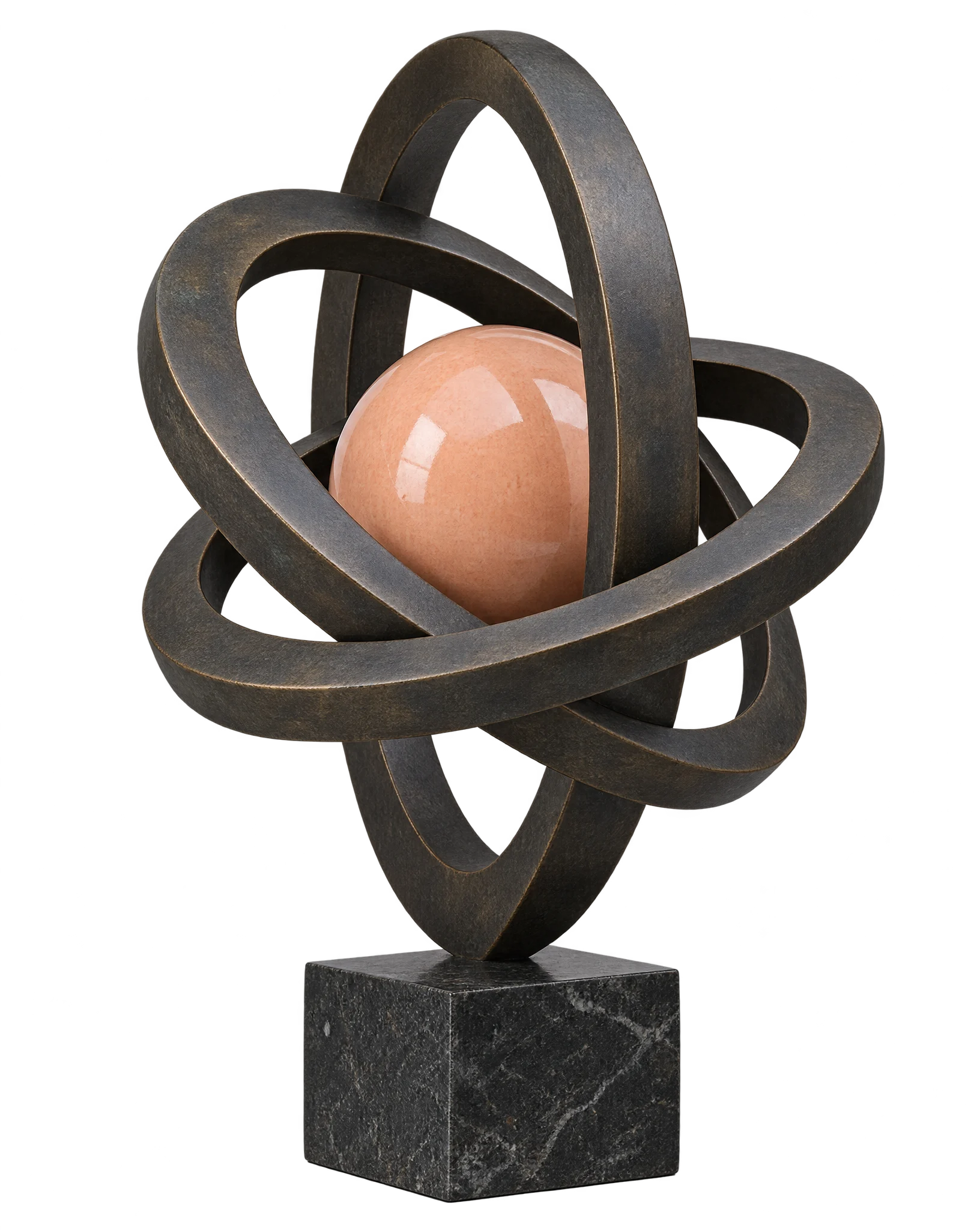 An abstract bronze sculpture of three interlocking rings around a peach-glazed ceramic sphere on a marble block
