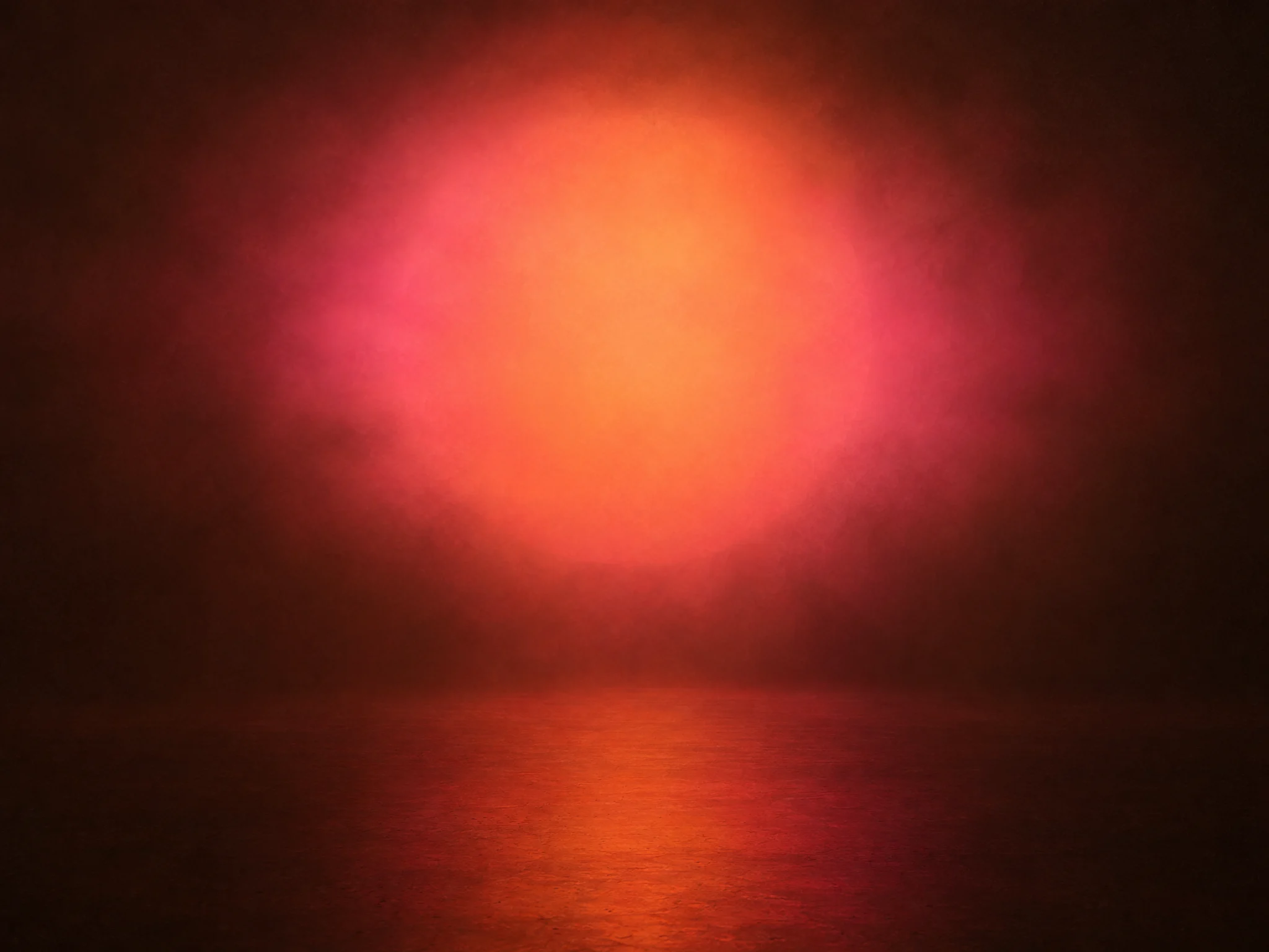 A soft round cloud of rose and apricot light above a dark floor that reflects it