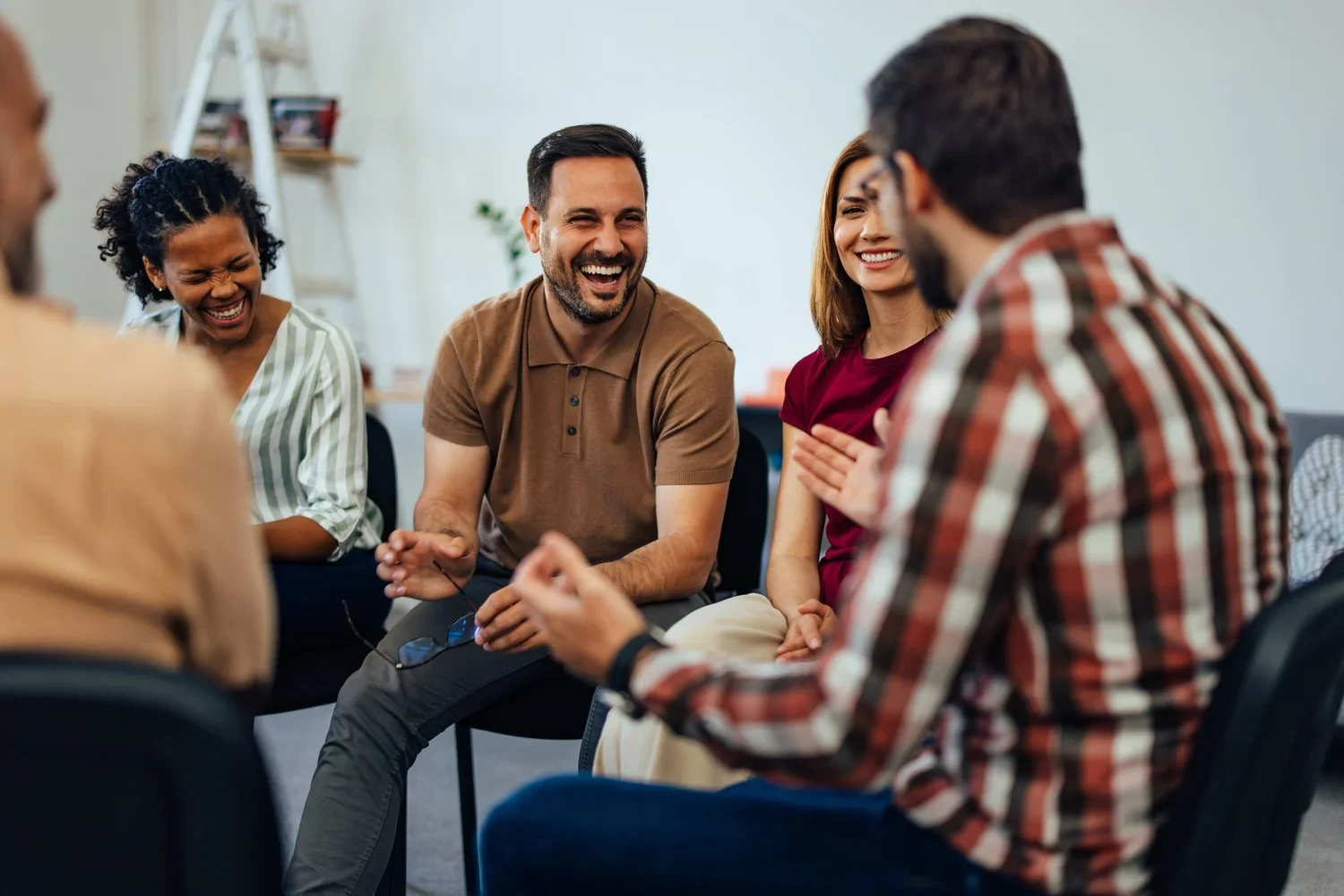 Adults sharing a conversation in a group setting