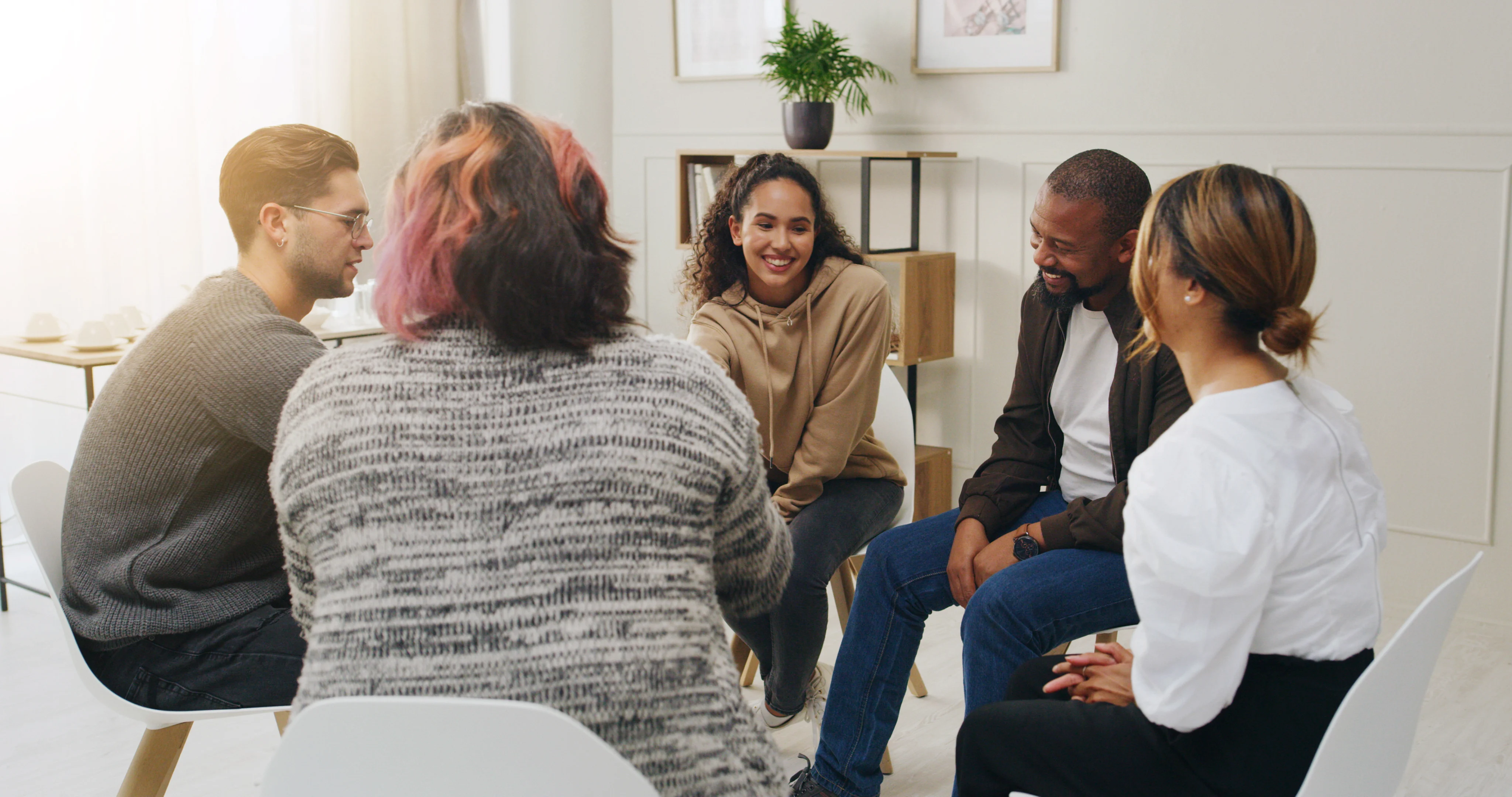 Adults talking together in a bright group room
