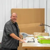 Small business operator assembling products at a WareSpace worktable