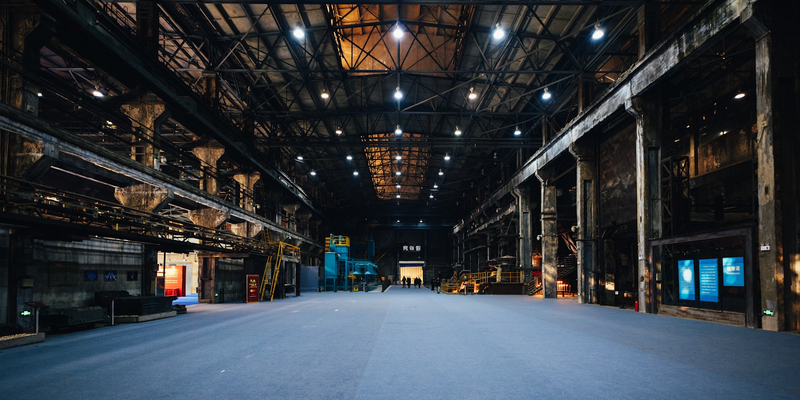 A vast traditional industrial warehouse interior