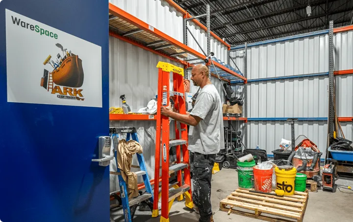 WareSpace contractor organizing ladders, tools, and job materials inside a private unit