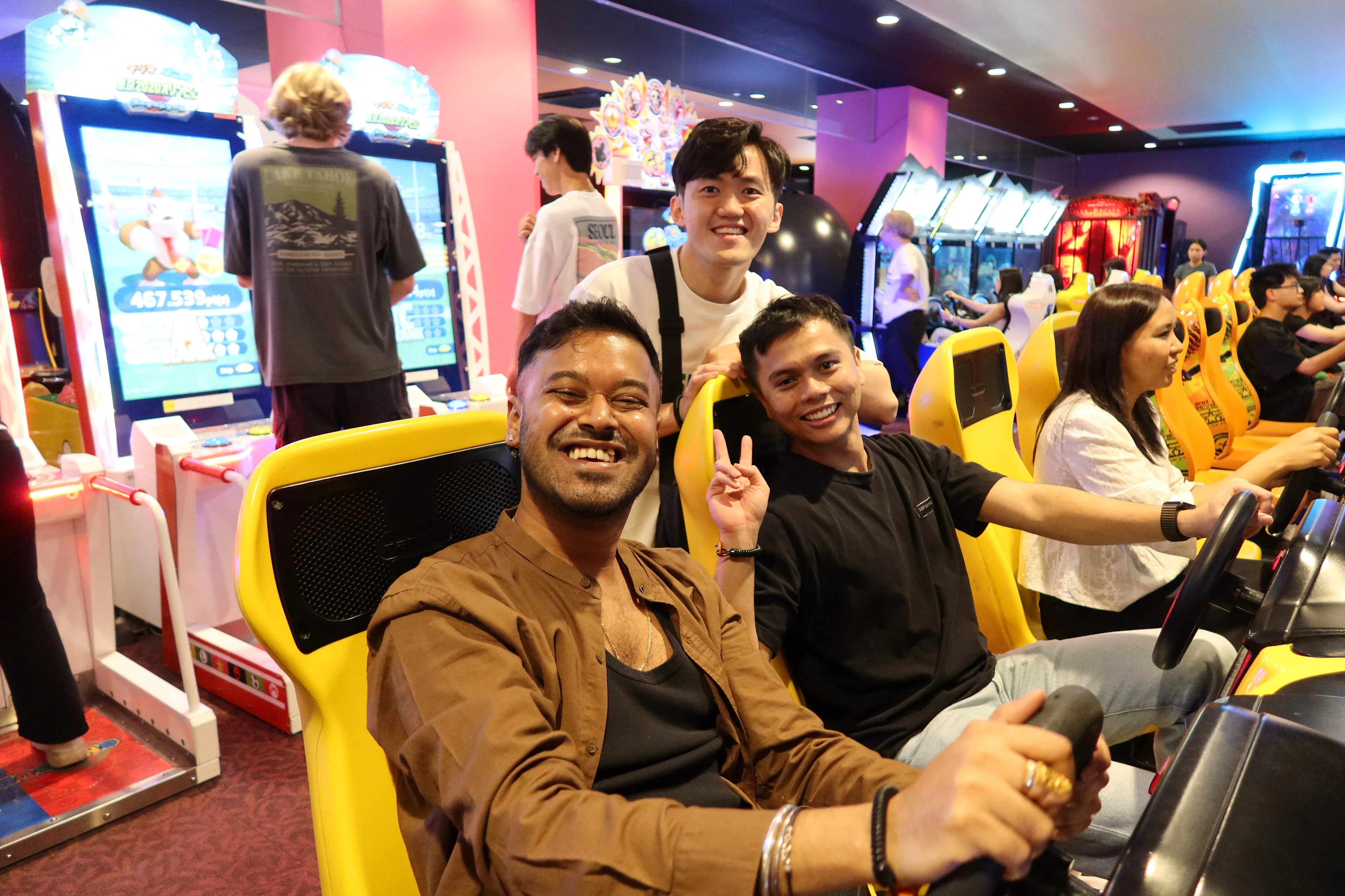 Checkbox teammates enjoying an arcade racing game