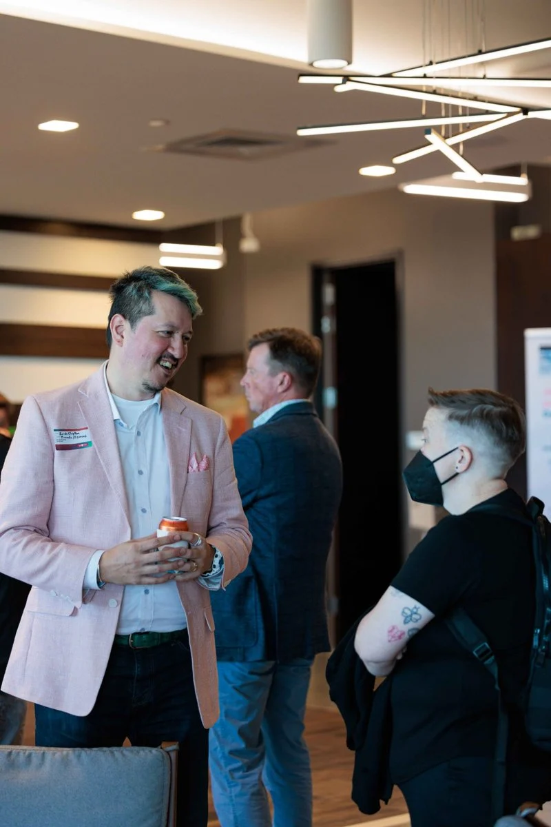 Two guests talk during networking at AI ❤️ CX Atlanta