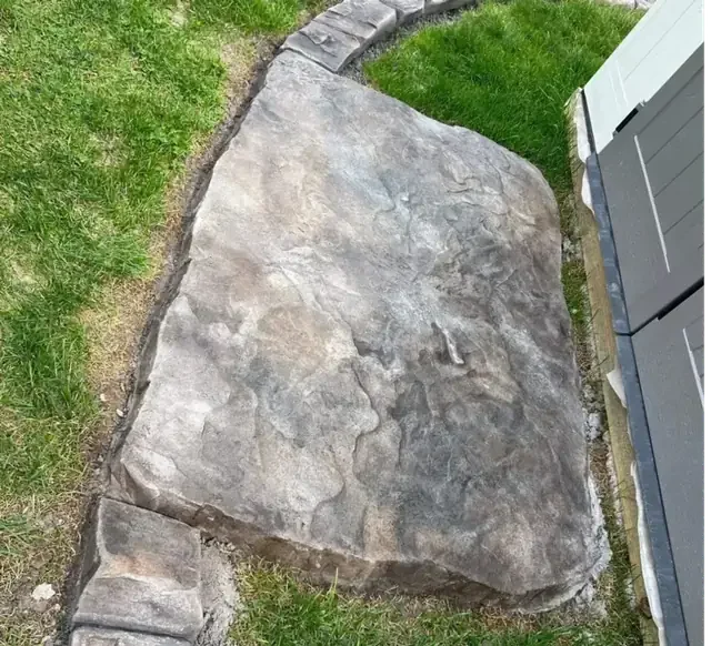 Decorative concrete stepping stones set in a lawn