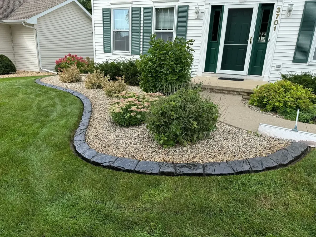 Front yard landscape beds edged with concrete curbing