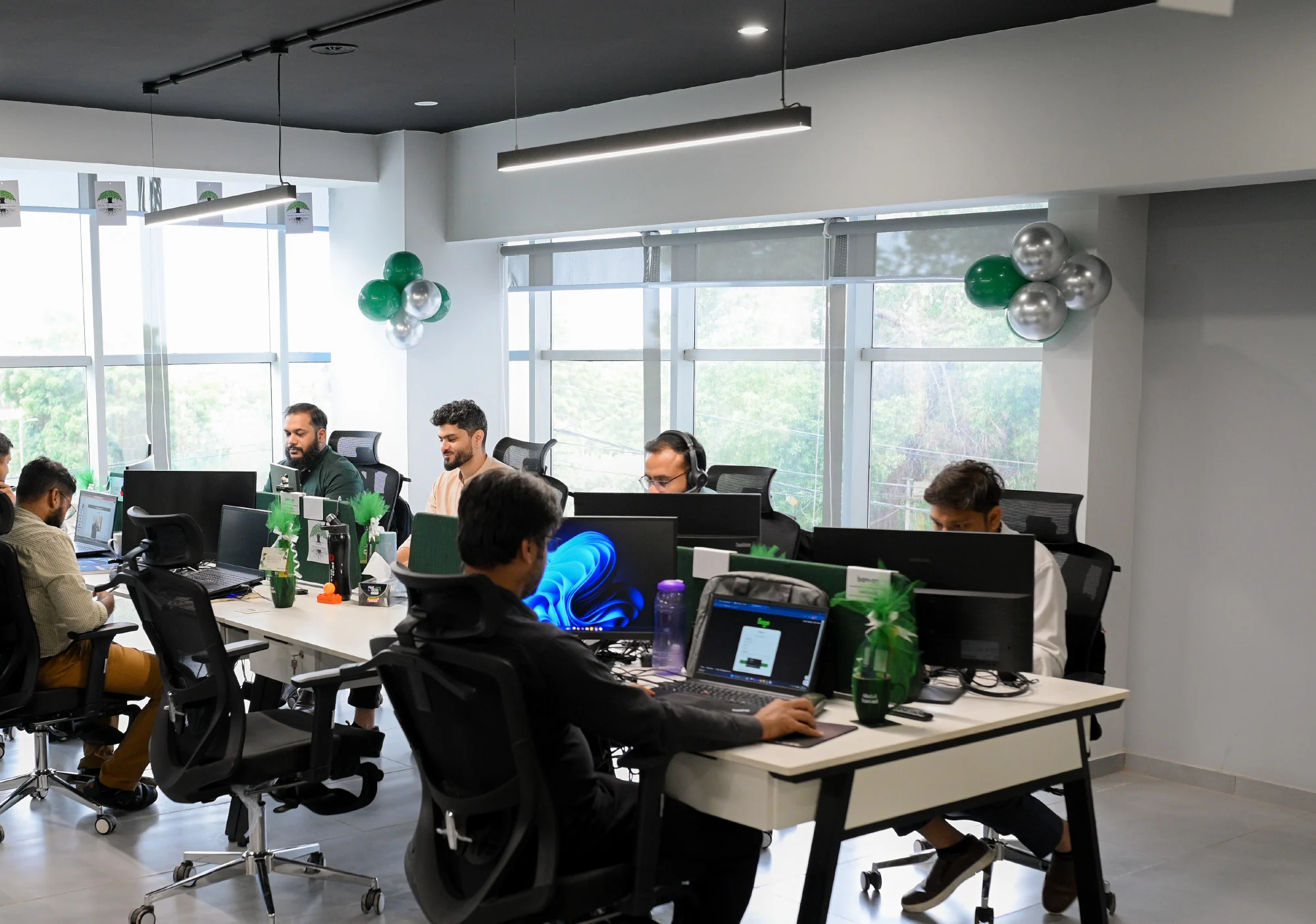 Banyan Canopy Group team collaborating in the Karachi office