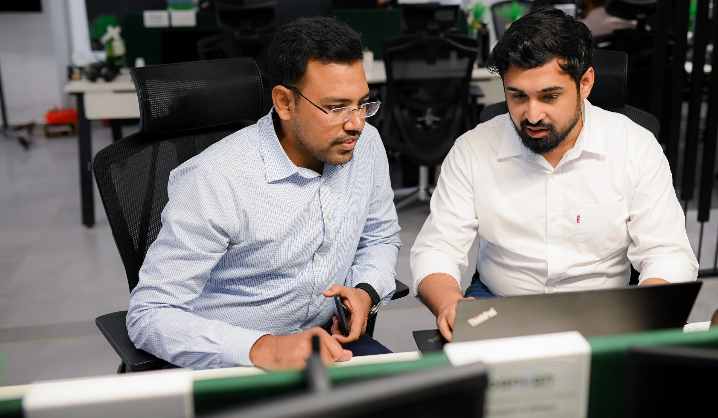 Banyan Canopy Group colleagues collaborating at a workstation