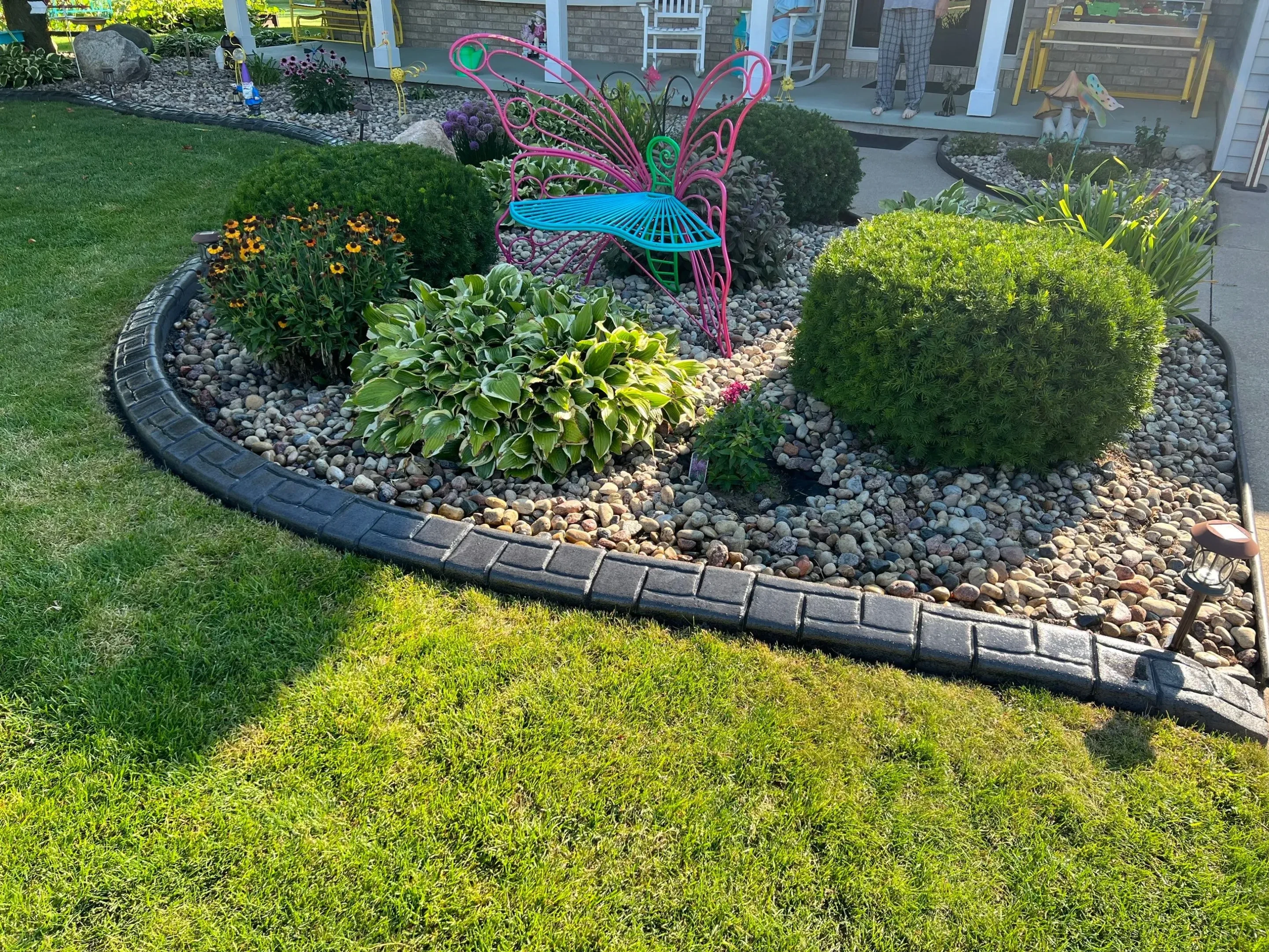Decorative concrete landscape curbing around a garden bed