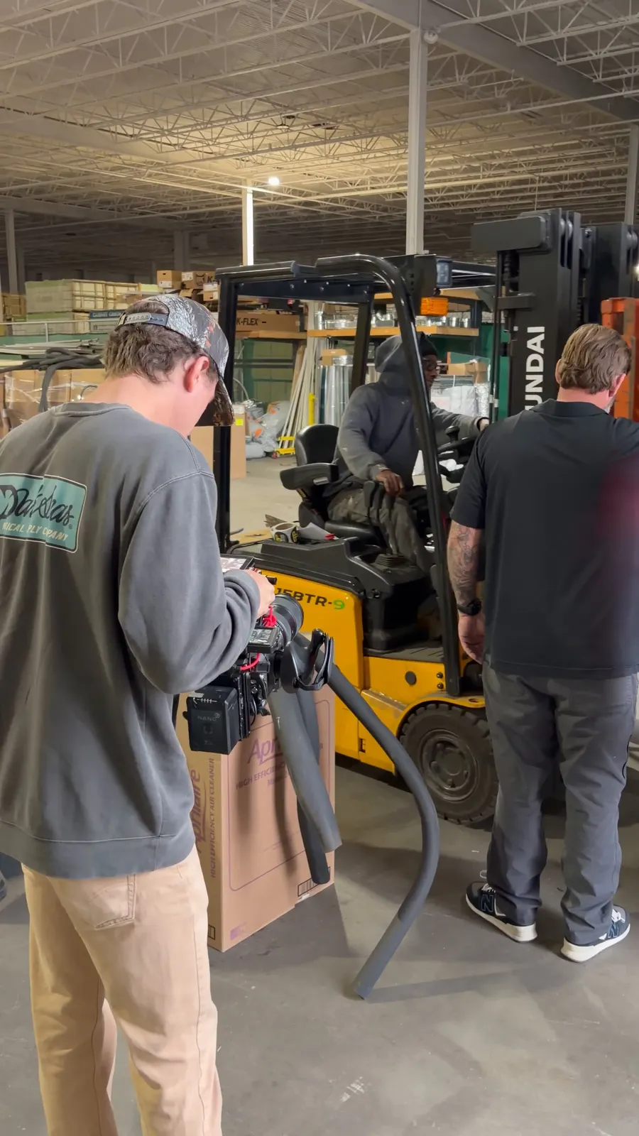 Filming a client's crew at work in their warehouse