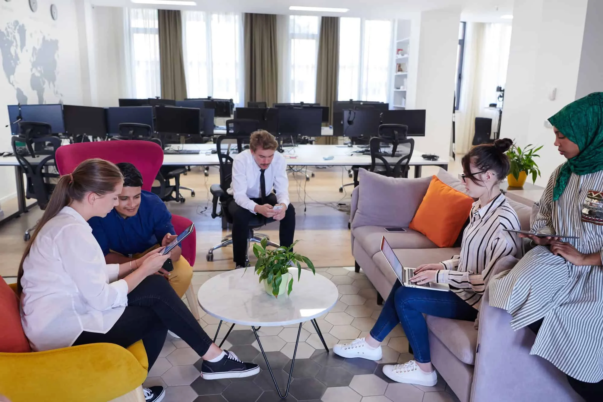 Multi-ethnic startup team collaborating in an office