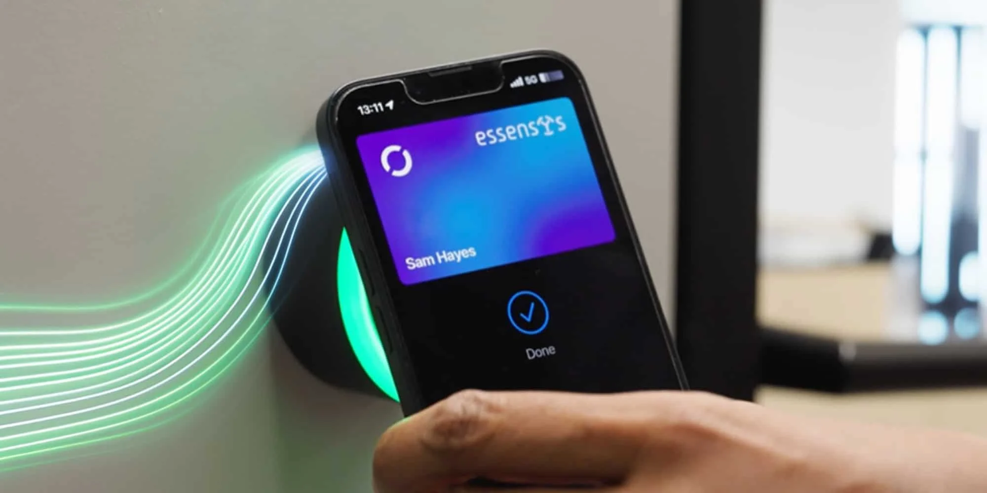 Phone tapping an elumo reader on a meeting room door.