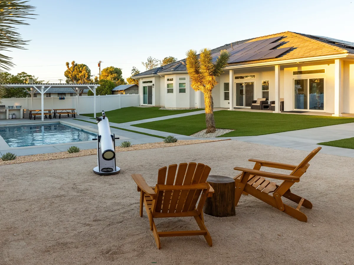Daytime pool, outdoor seating and residential grounds