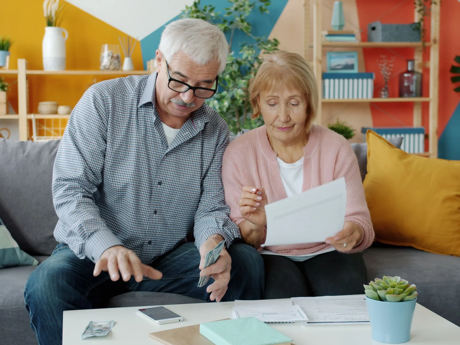 Older couple reviewing retirement finances together at home