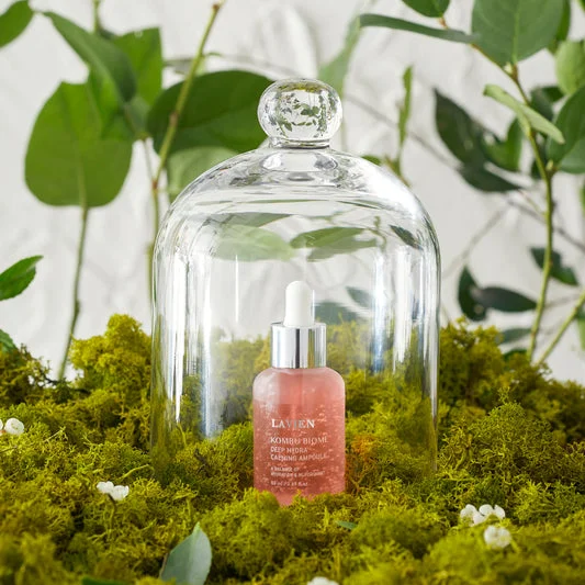 LAVIEN Kombu Biome calming ampoule displayed inside a glass cloche with moss