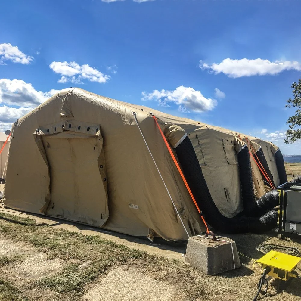 User-supplied image of a sand-colored inflatable shelter with a closed entrance and external ducts