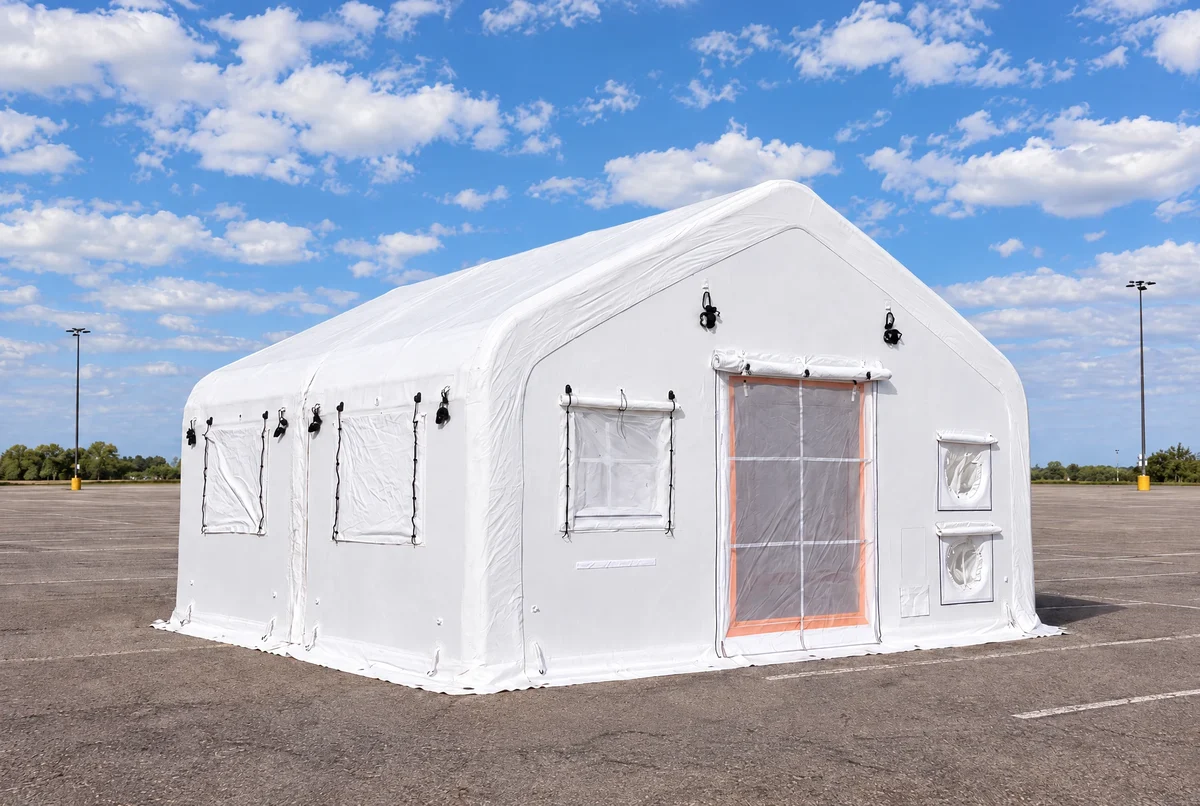 White drop-stitch inflatable tent with a front entrance and side windows