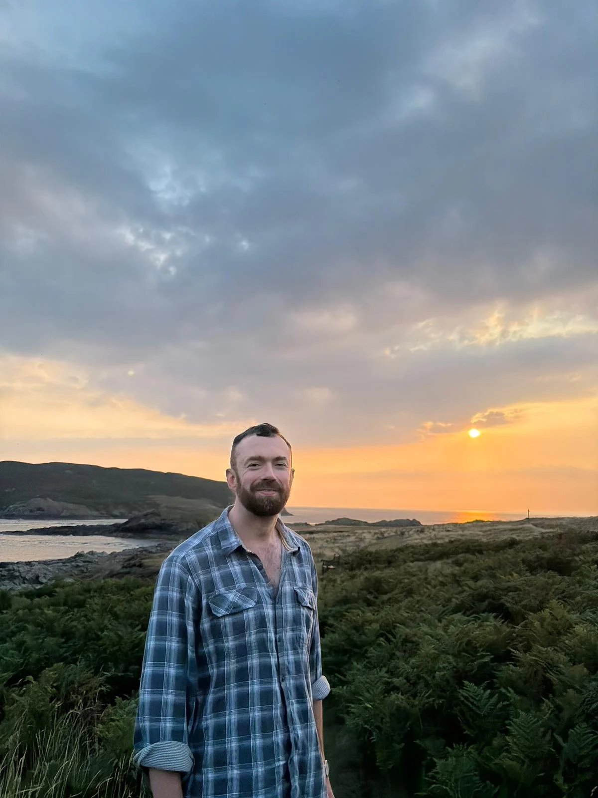 James Kingston on the Manx coast at sunset