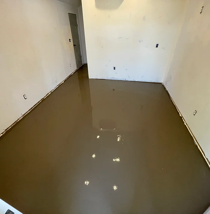 Self-leveling material placed on a floor by Yankee Coatings