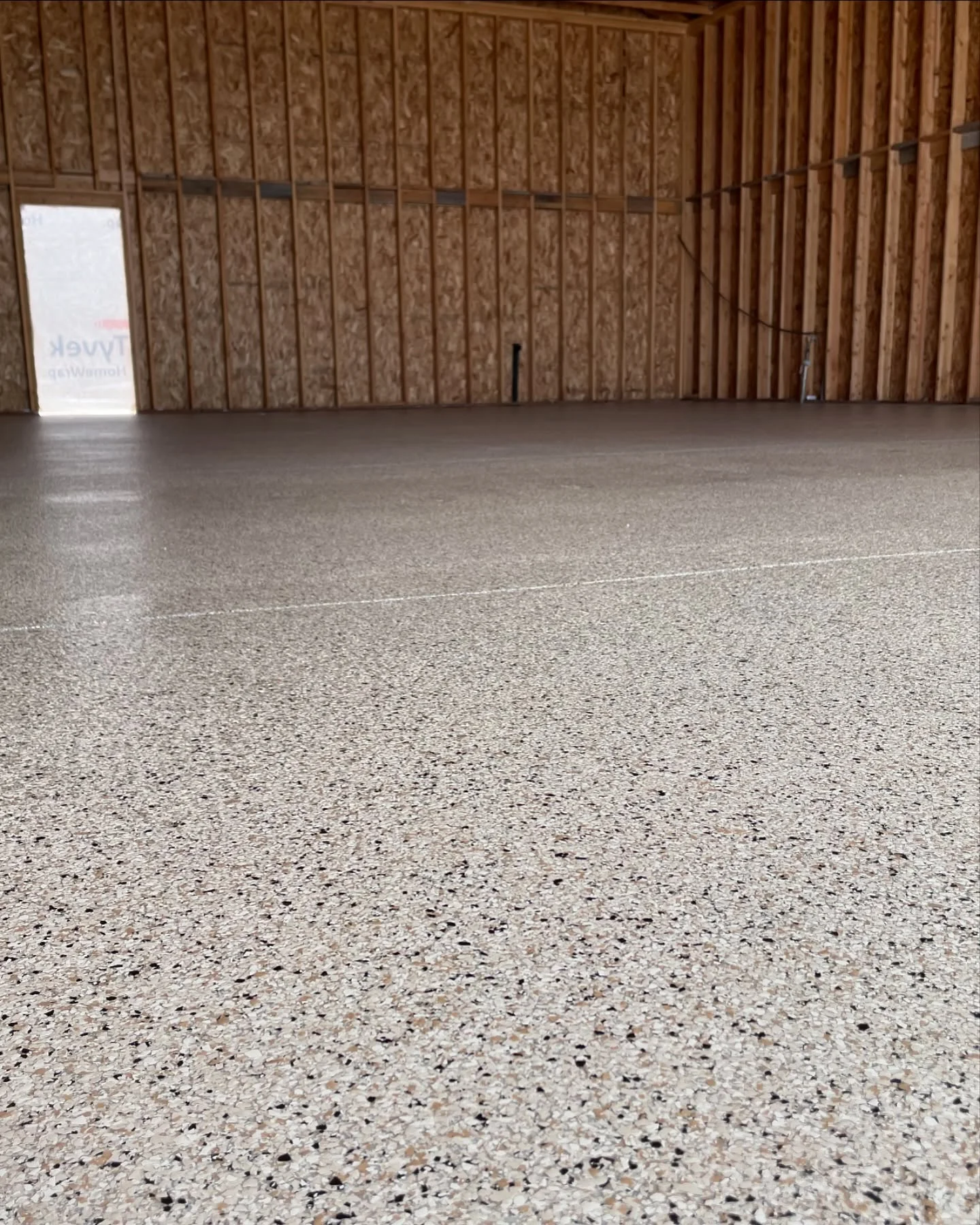 Light-colored flake floor in a wood-framed building
