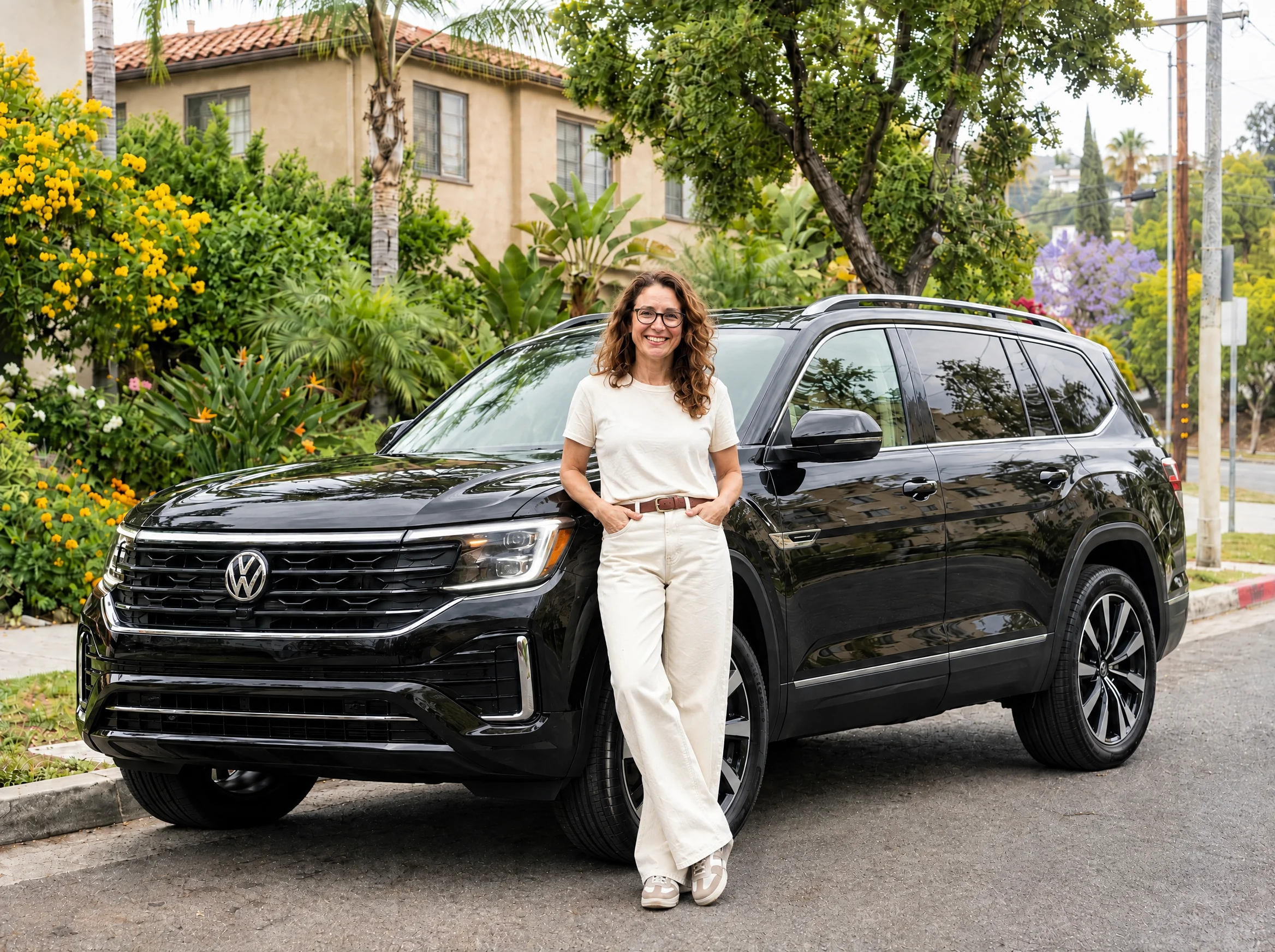 8Fleet driver beside a black Volkswagen Atlas in Los Angeles