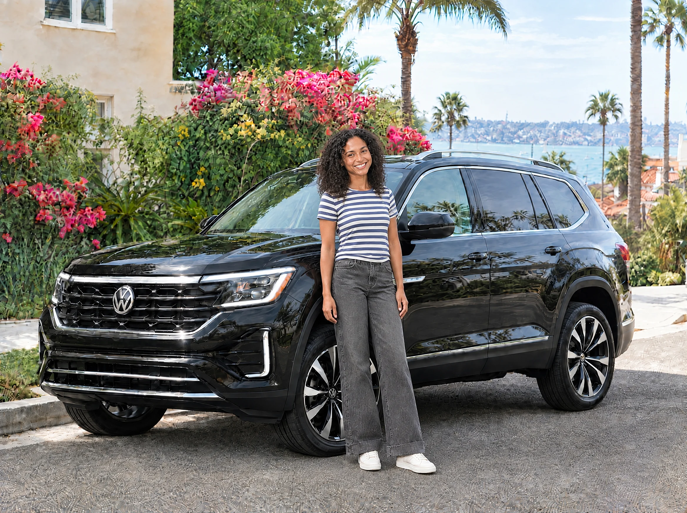 8Fleet driver beside a black Volkswagen Atlas in San Diego