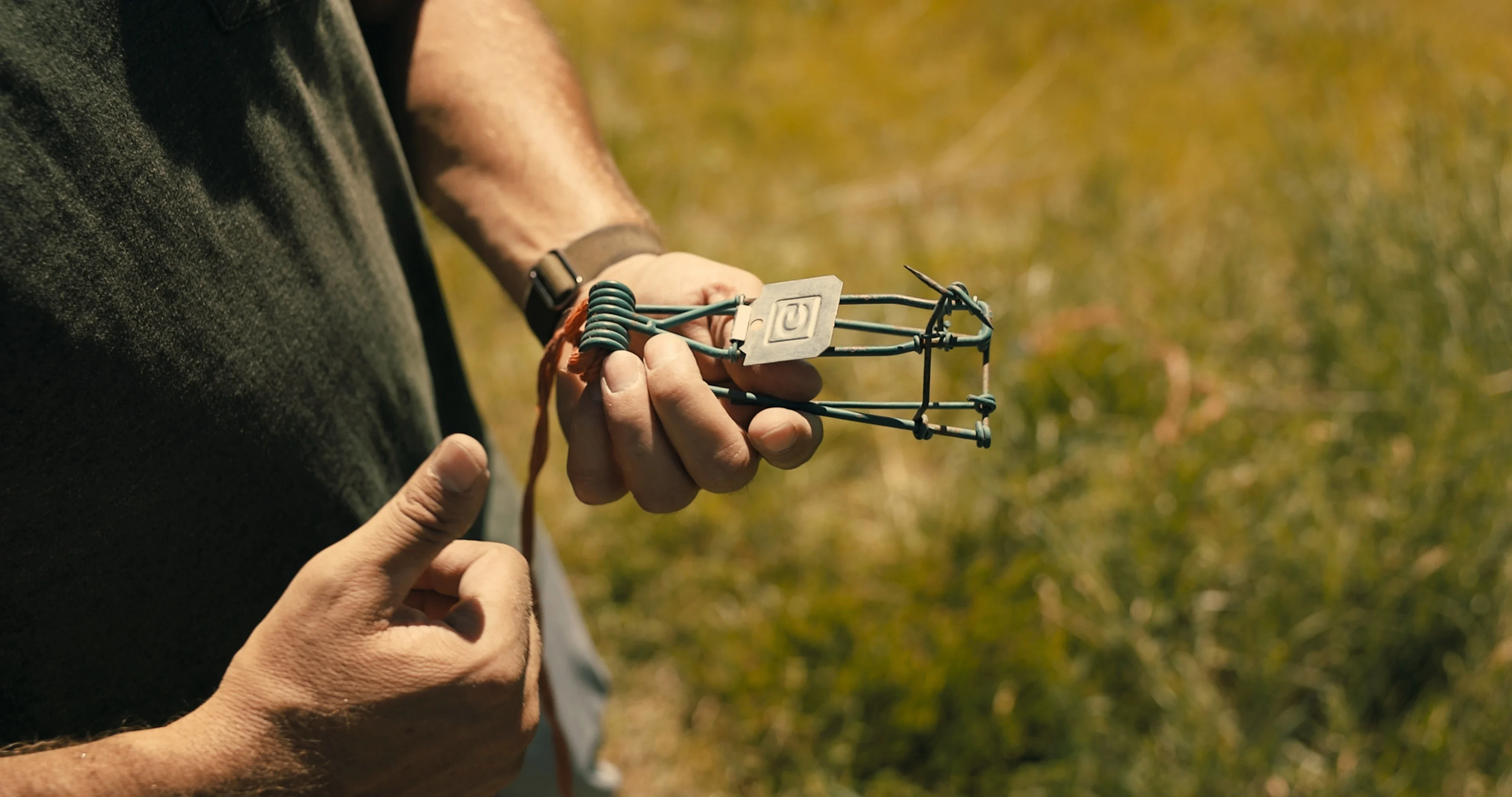 Pest control technician demonstrating a field trap