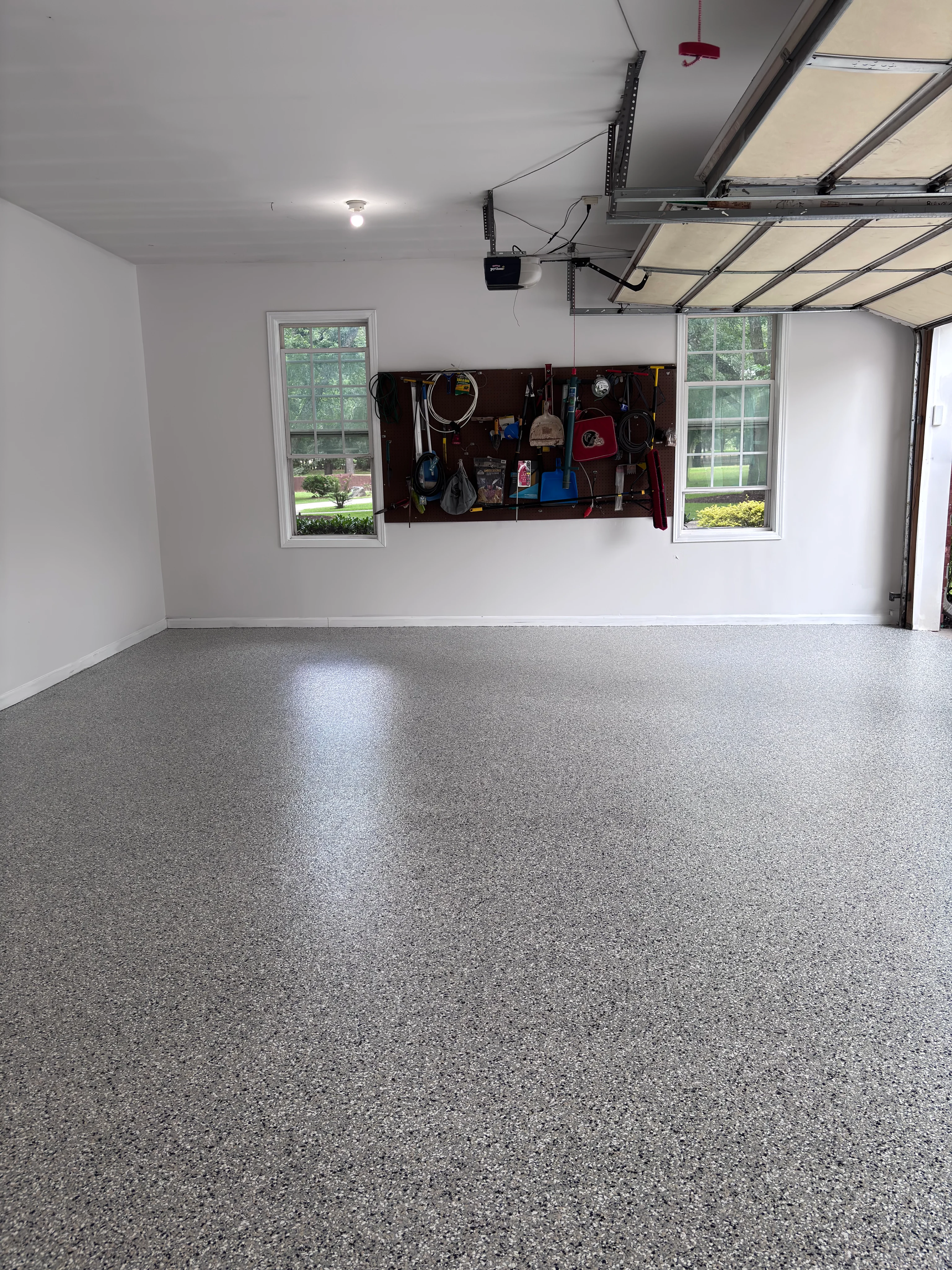Gray speckled epoxy floor in a residential garage