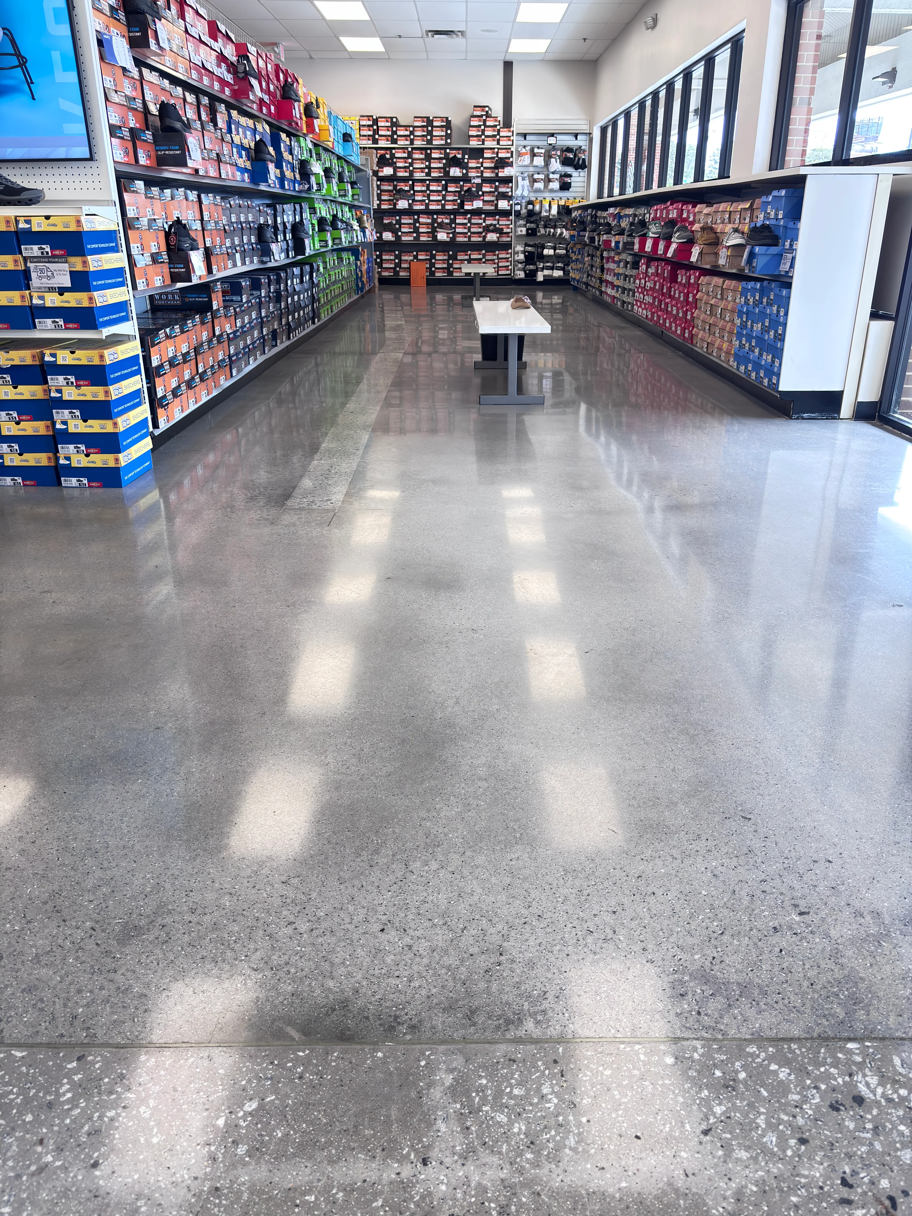 Polished concrete floor inside a retail shoe store