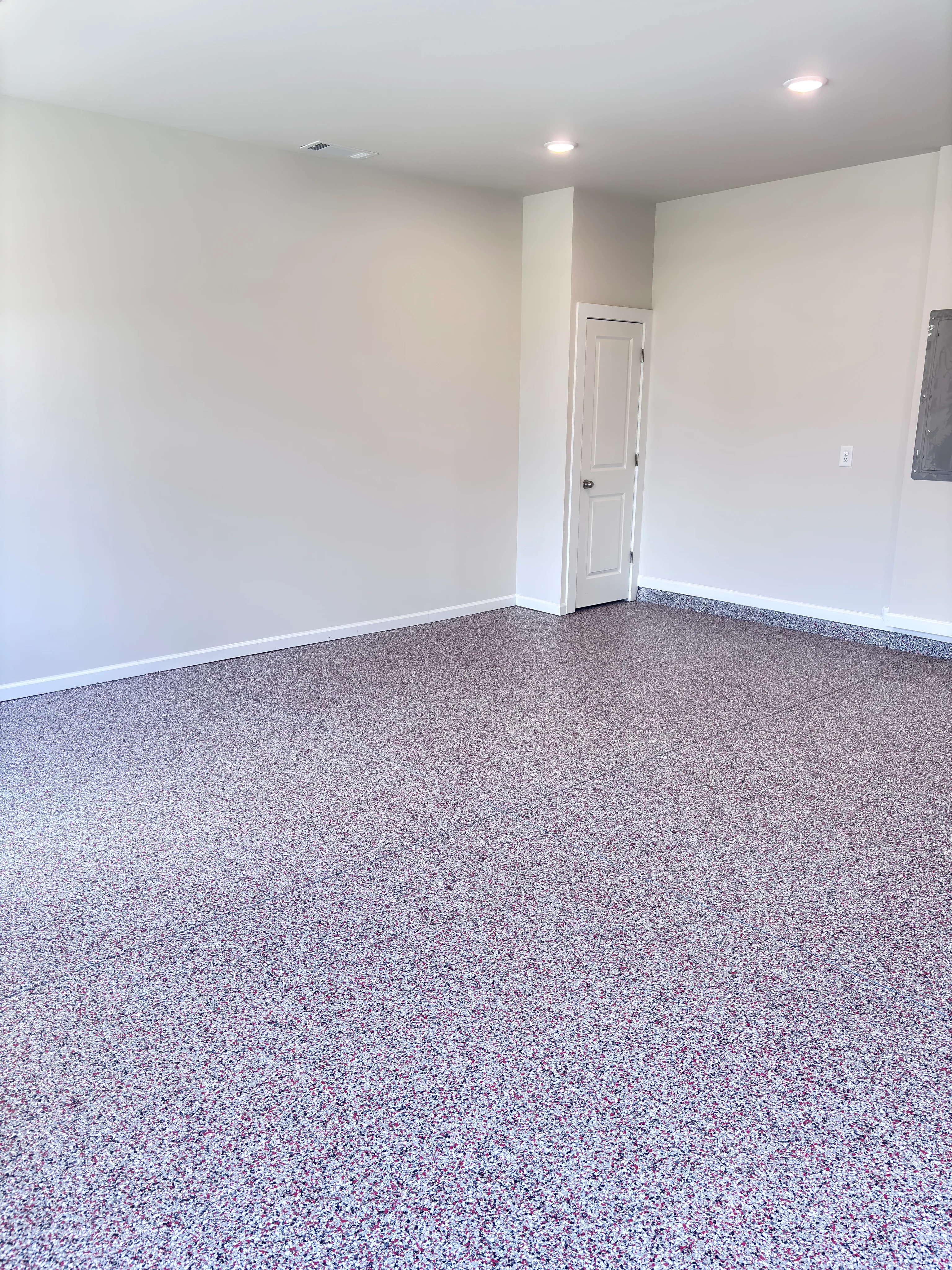 Speckled floor coating in a bright residential room