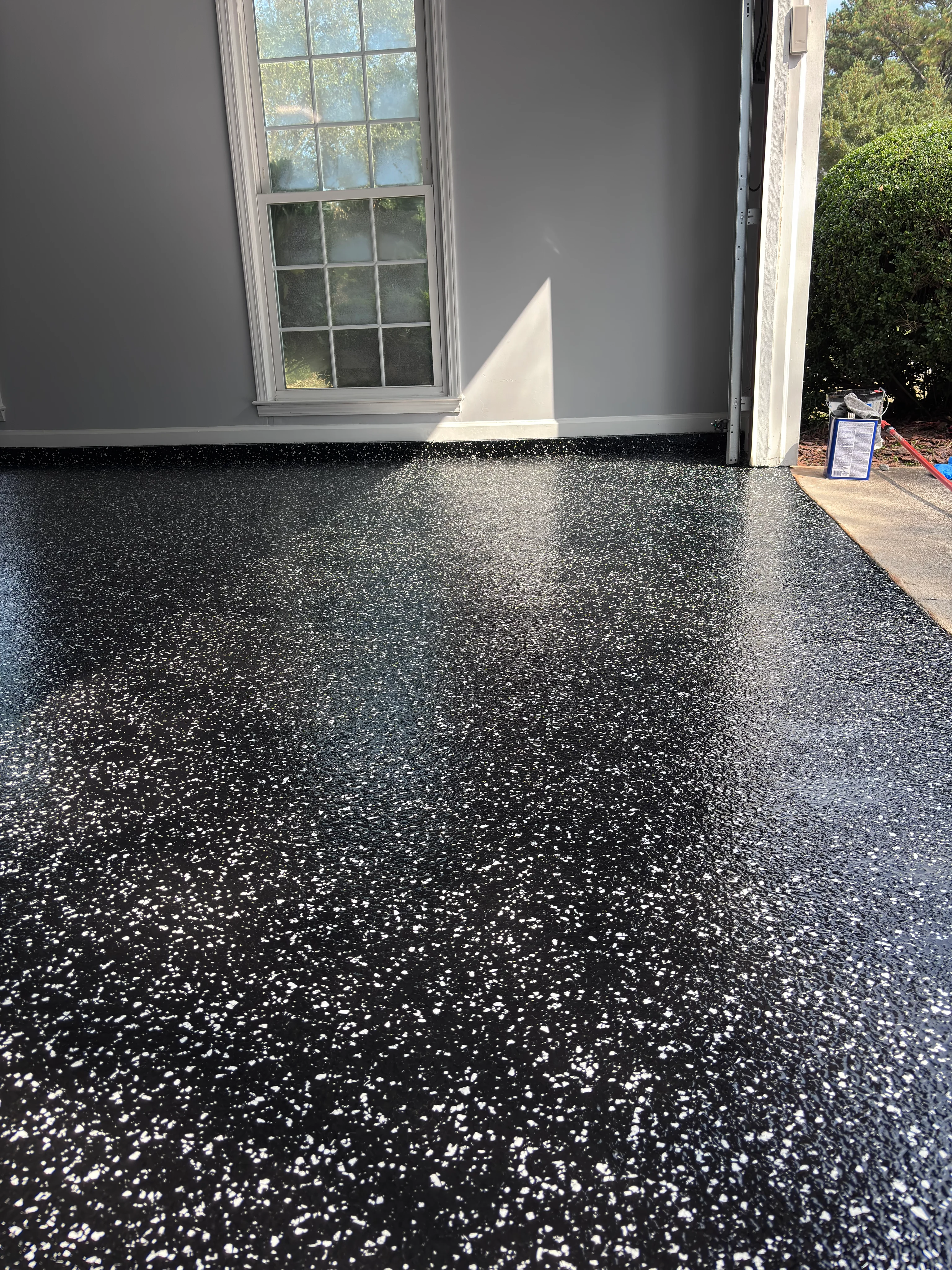 Black flake floor coating in a residential garage