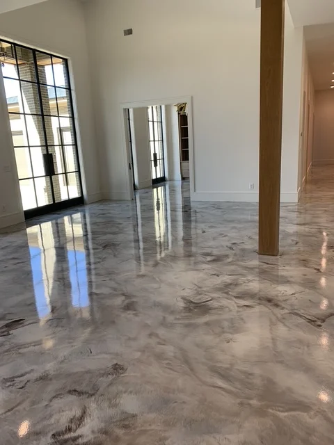 Marbled metallic epoxy floor in a modern open-plan interior