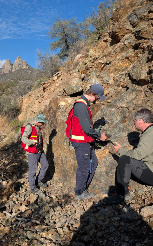 Geologists sampling an outcrop in Arizona