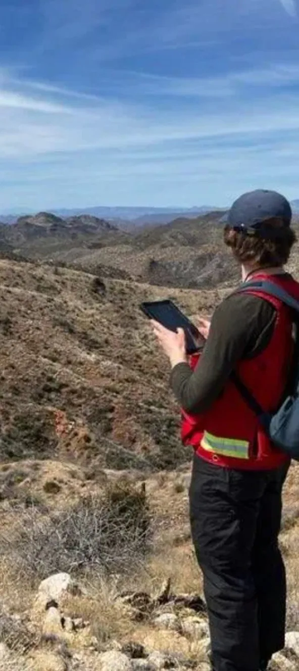 Geologist mapping with a tablet in the Arizona hills