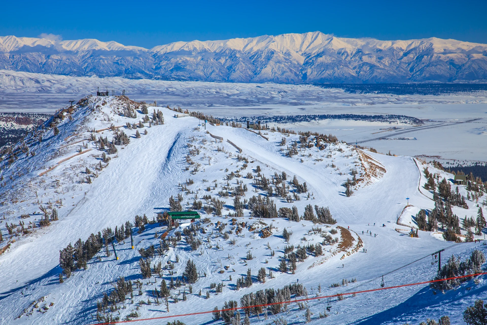 Snow-covered Mammoth Mountain ski terrain and Eastern Sierra ranges