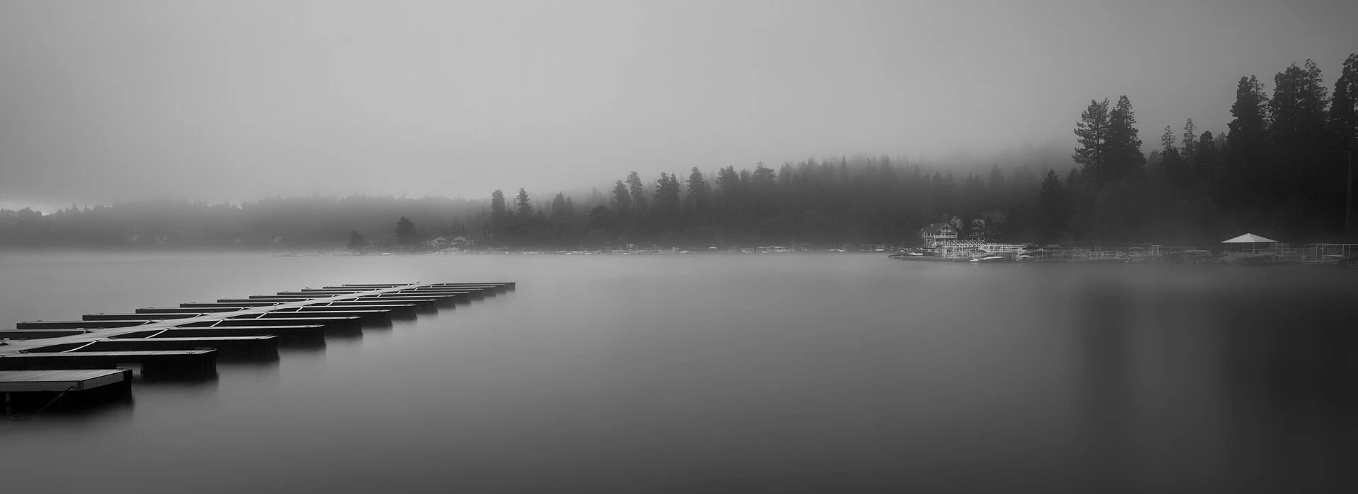 Lake Arrowhead docks and forest in morning fog