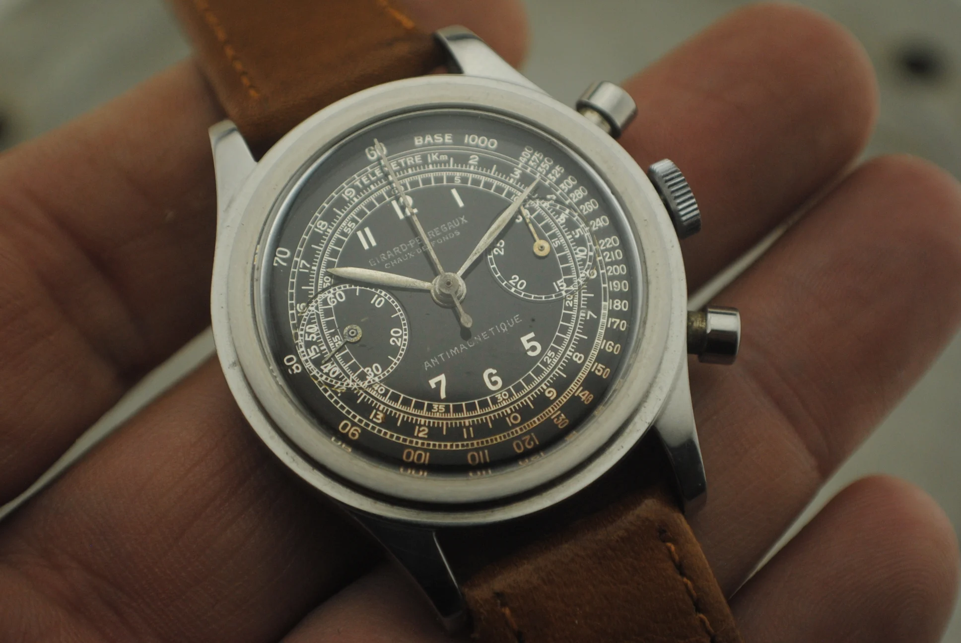 Closer crystal-on view of the Girard-Perregaux two-register chronograph dial, stepped case, crown, and round pushers