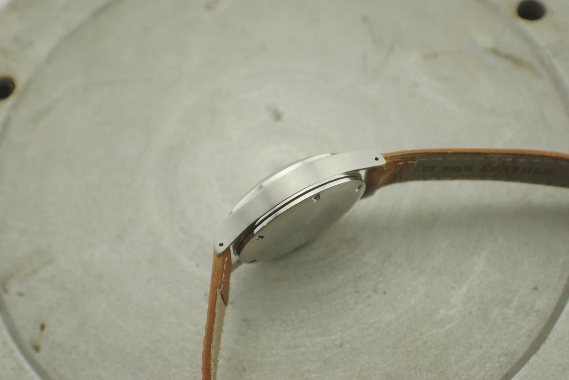 Opposite profile of the Girard-Perregaux stainless-steel stepped case and screw-down caseback