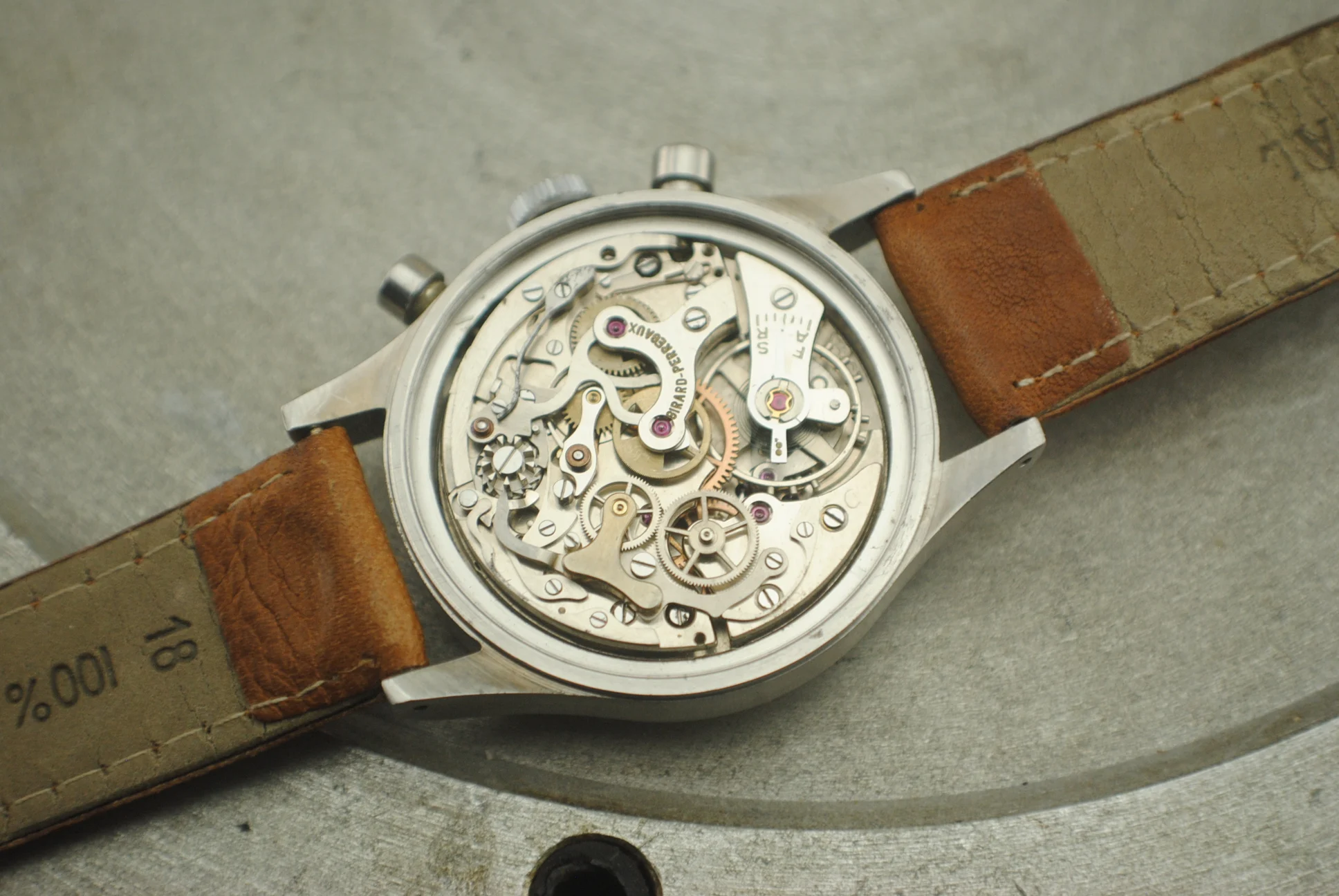 Open Girard-Perregaux chronograph showing the signed hand-wound mechanical movement