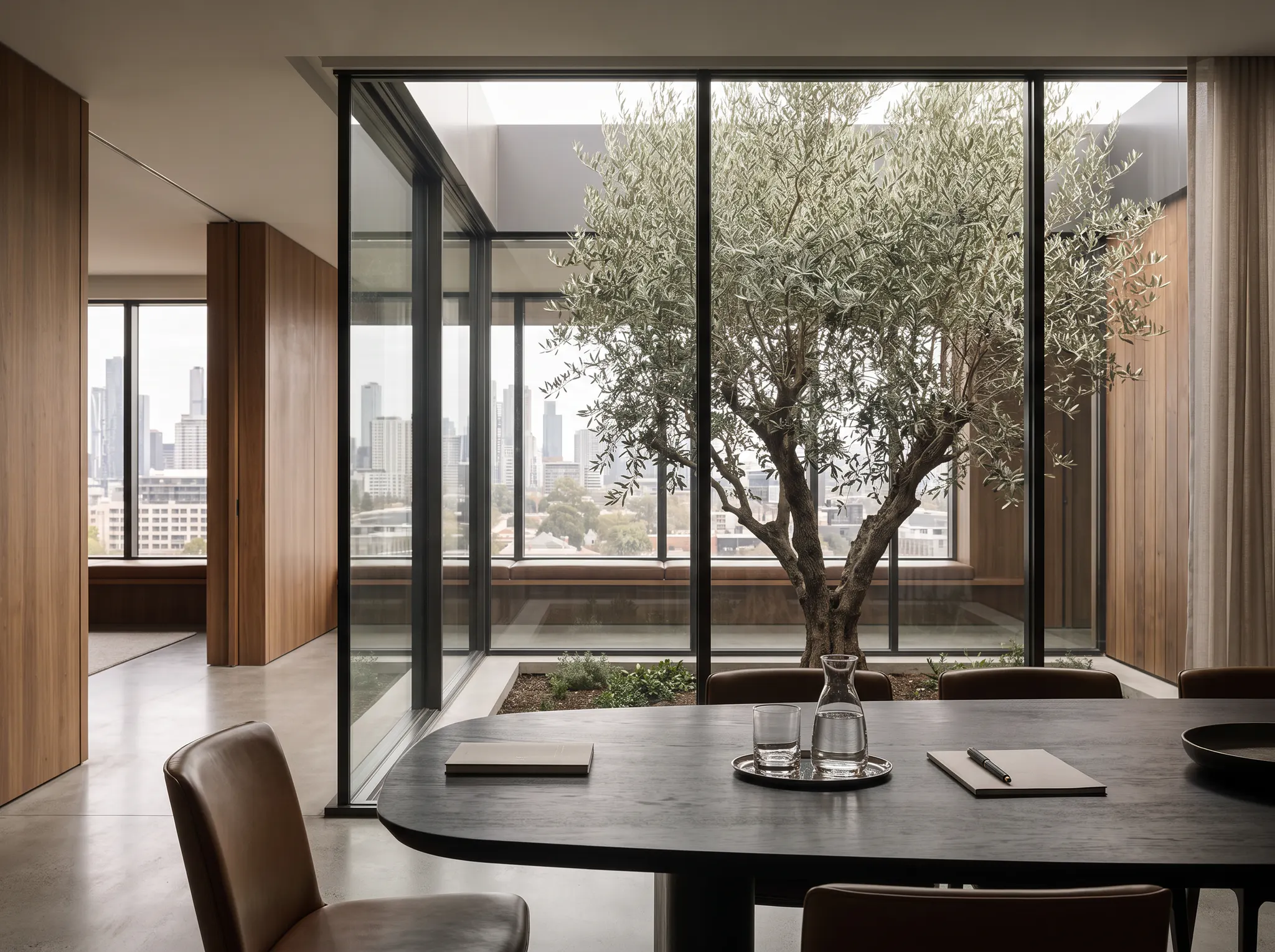 A refined Australian boardroom overlooking a mature tree
