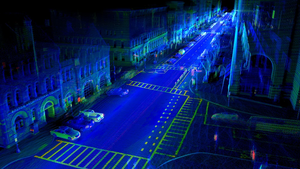 LiDAR point cloud showing a city intersection, crosswalks, and surrounding street assets