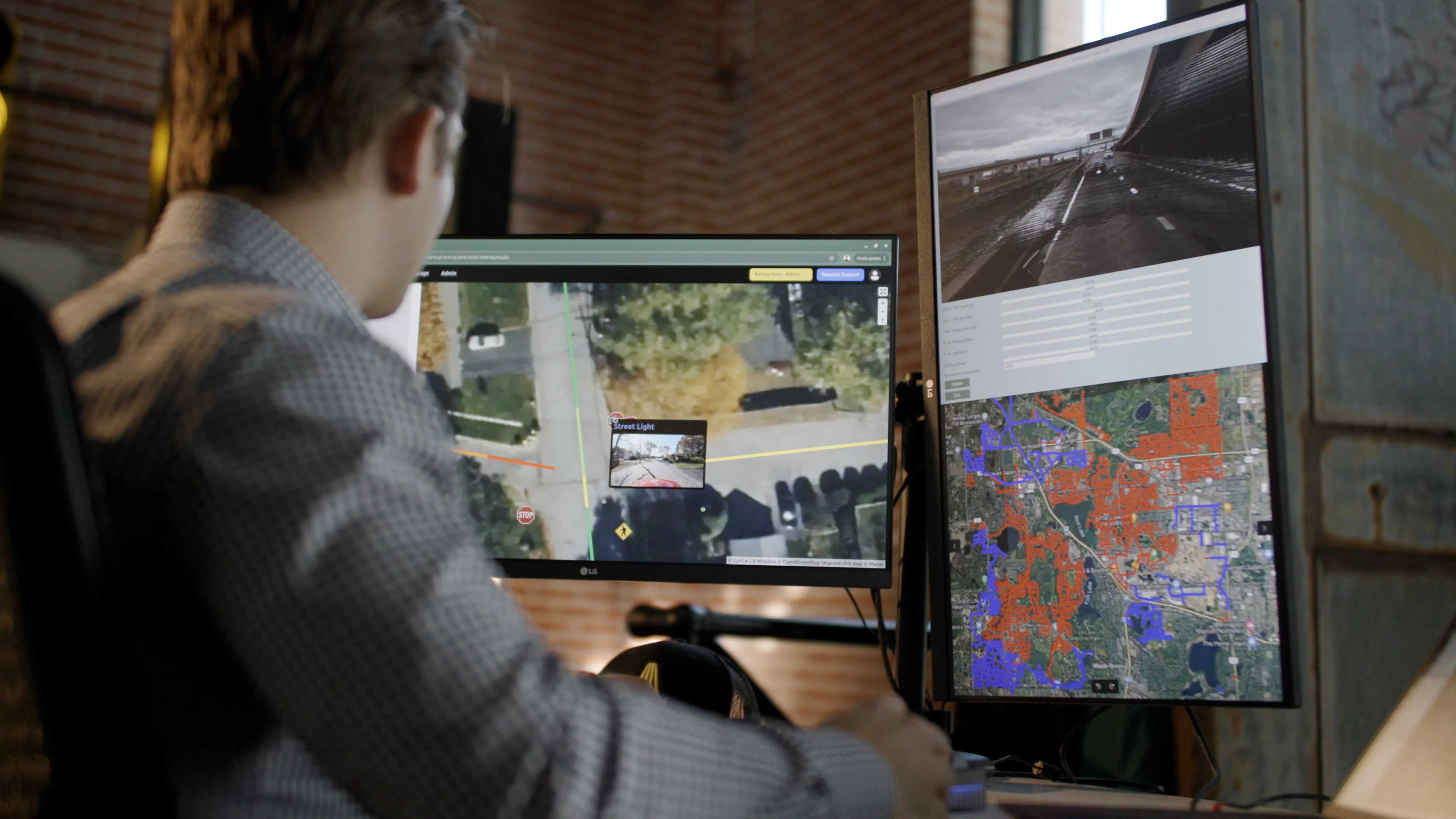 Engineer reviewing city streets and infrastructure data on screens