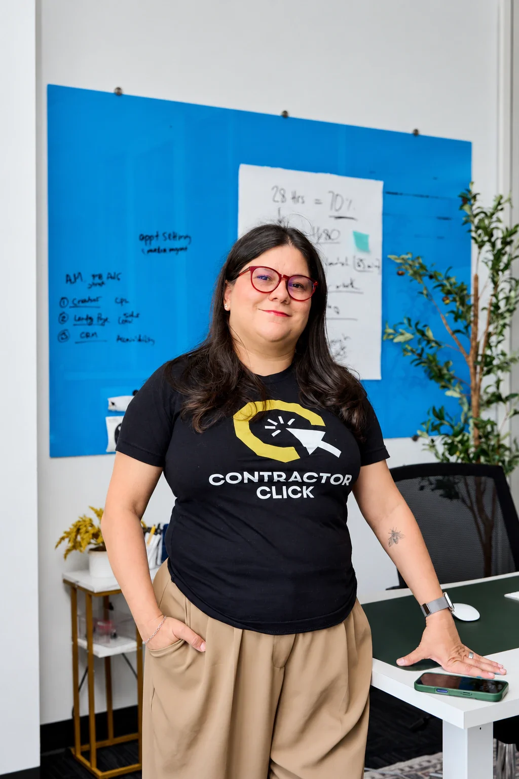 Mady Barrera at a strategy whiteboard in the Contractor Click office