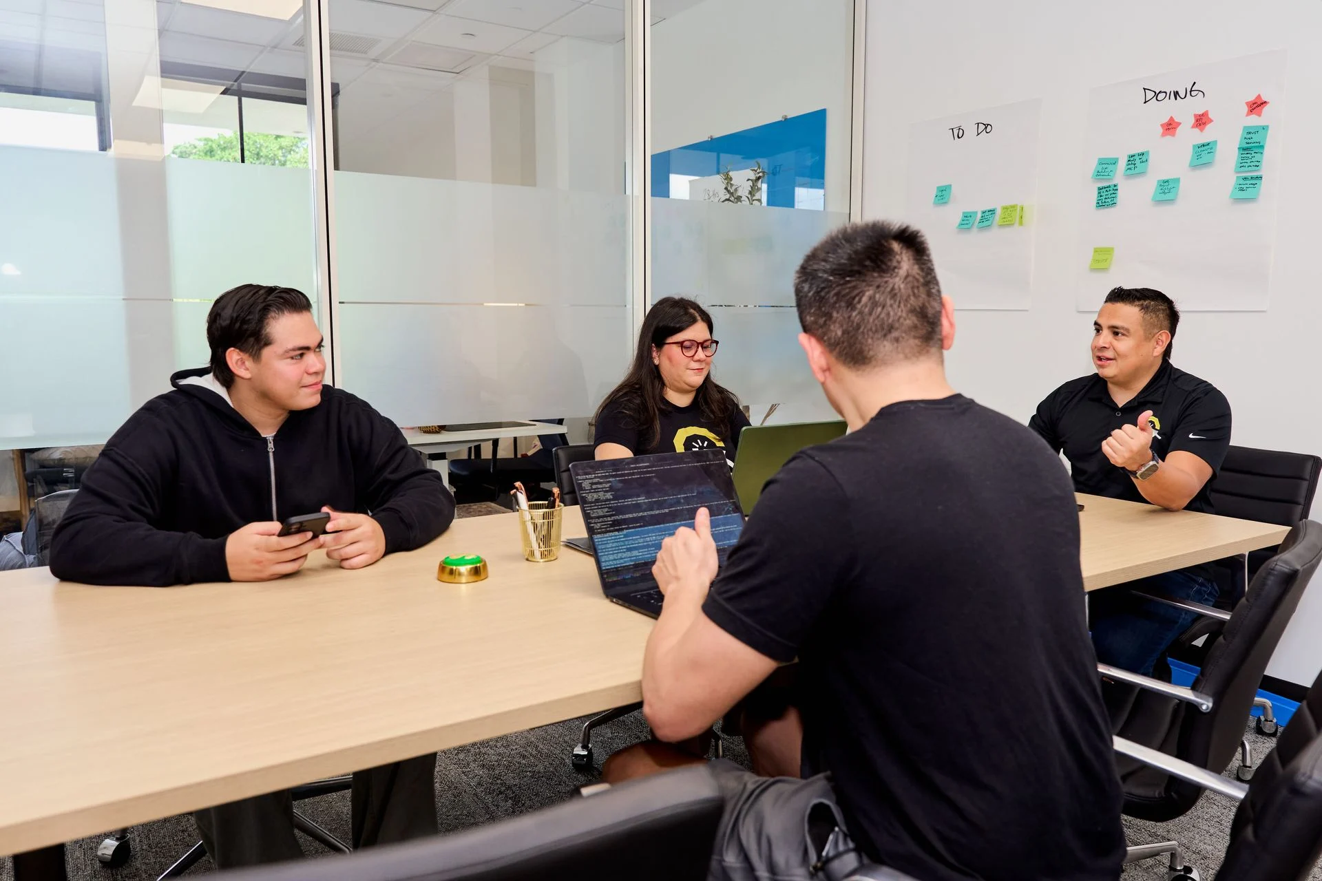 Contractor Click team members collaborating around a conference table