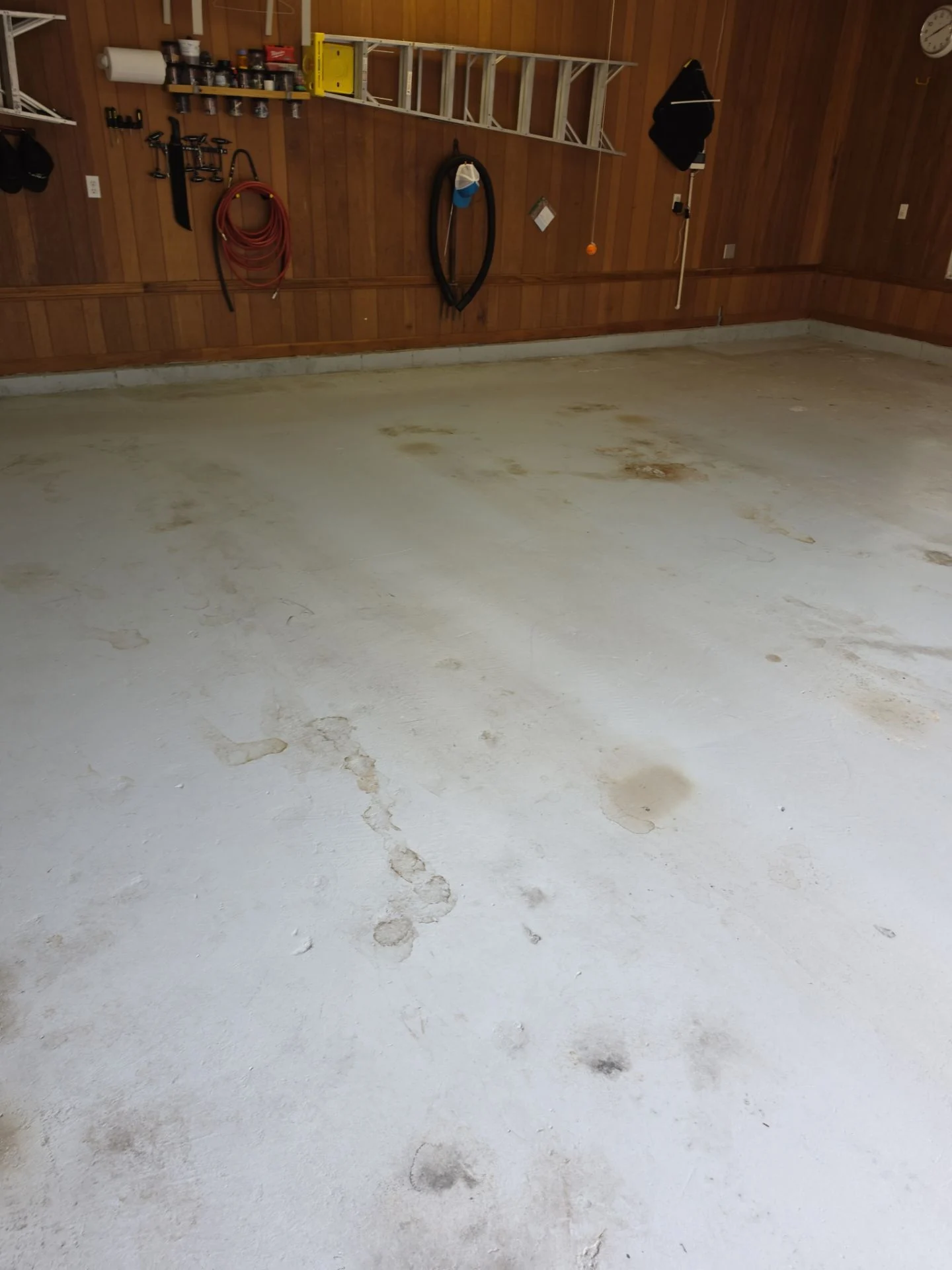 Stained concrete garage floor before coating