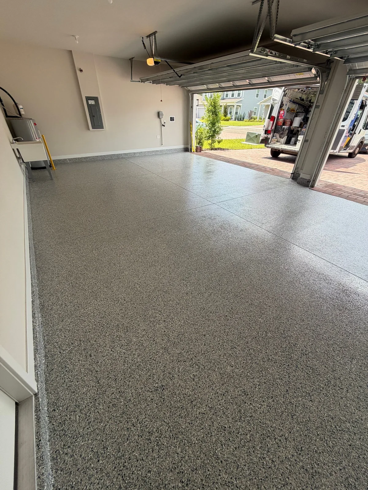 Finished gray flake coating in a residential garage