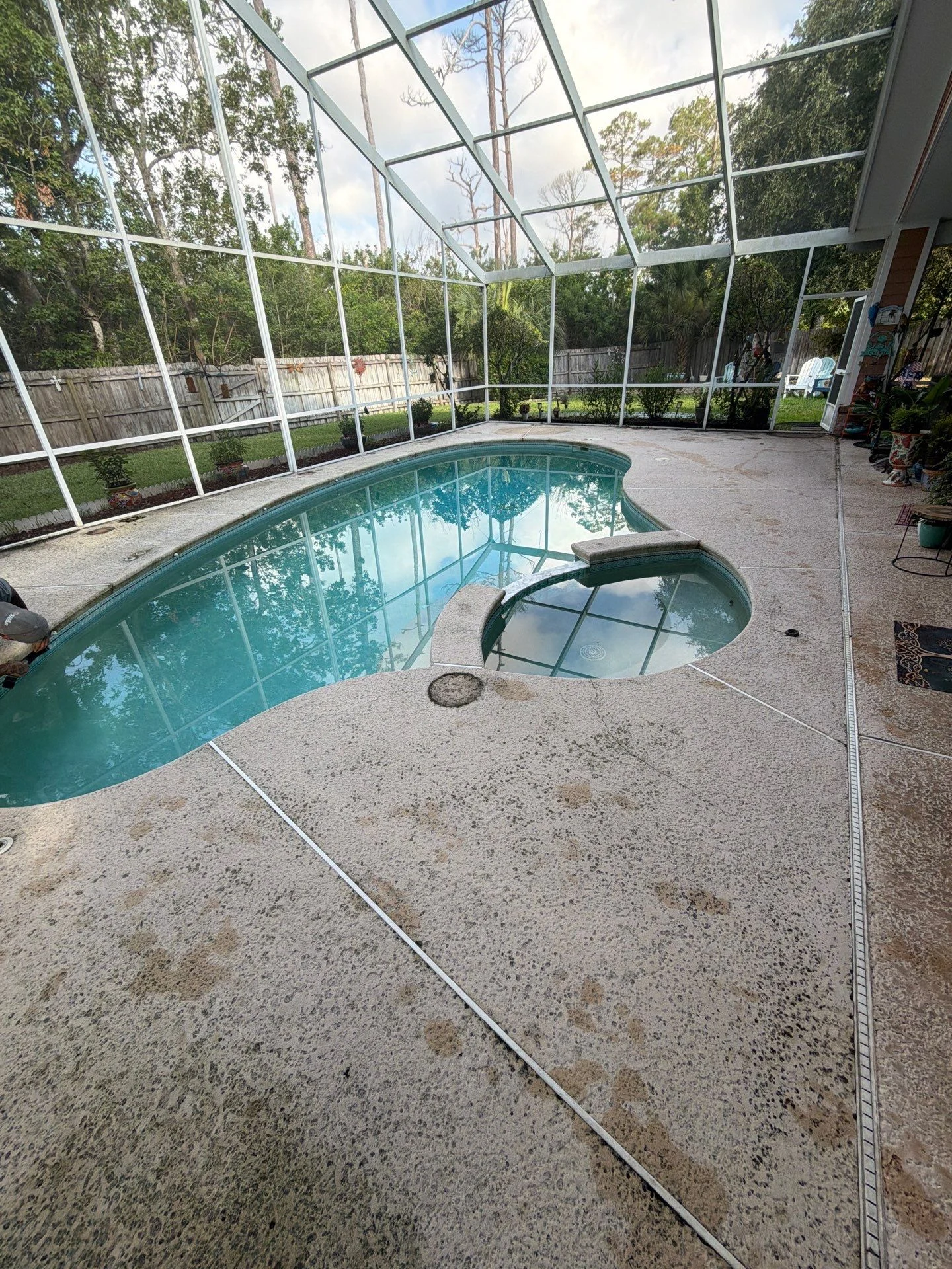 Stained concrete pool and spa deck before coating