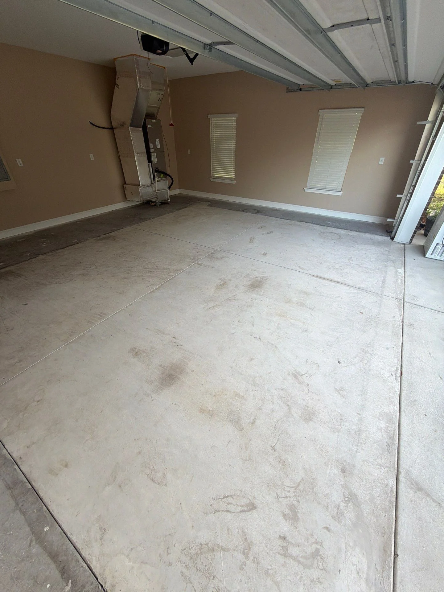 Uncoated residential garage floor before preparation